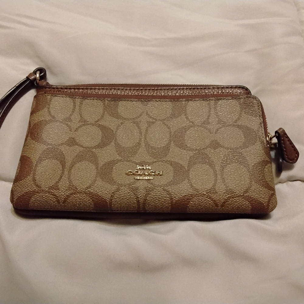 Large Coach Brown Signature Wristlet. 3 pockets fits cell phone keys and money